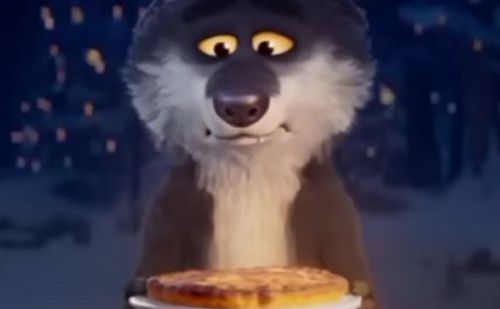 Le loup de la publicité de Noël Intermarché tenant une tarte aux pomme